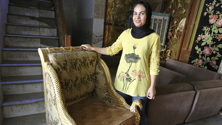 Iraqi carpenter Nour al-Janabi displays a piece at her home furniture workshop in Baghdad's Abu Dsheer area, Nov. 13, 2022. (Photo: Sabah Arar/AFP)