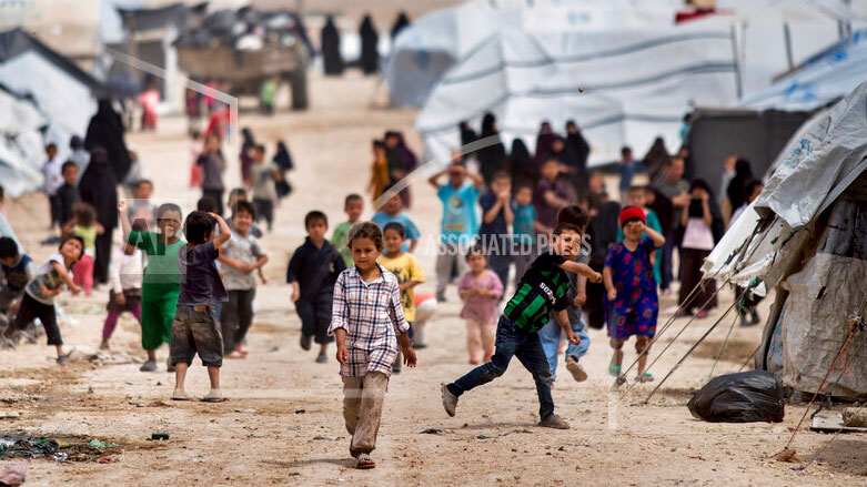 Children gather outside their tents at the al-Hol camp, which houses families of members of the Islamic State group, in Hasakeh province, Syria, May 1, 2021. (Photo: AP /Baderkhan Ahmad, File)