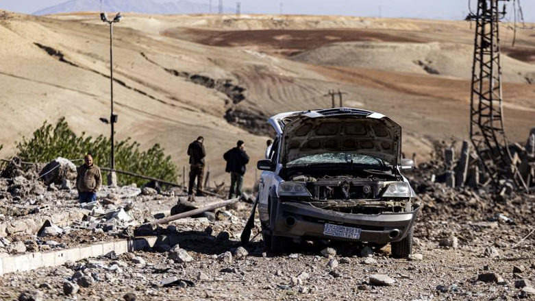 People inspect a site damaged by Turkish airstrikes that hit an electricity station in the village of Taql Baql, in Hasakeh province, Syria, Sunday, Nov. 20, 2022 (AP Photo/Baderkhan Ahmad)