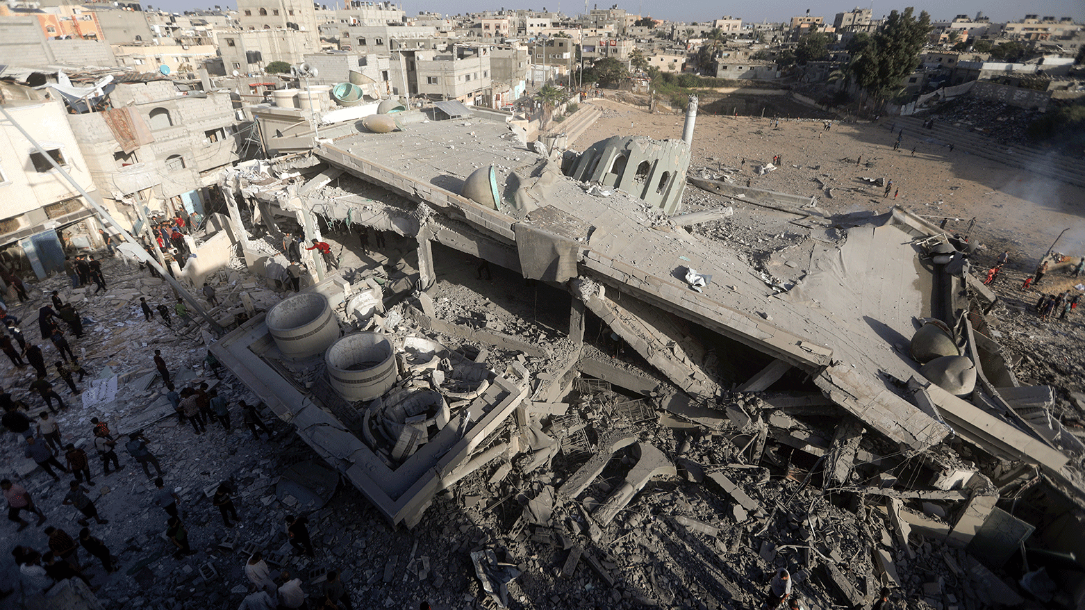 Palestinians inspect the damage of a destroyed mosque following an Israeli airstrike in Khan Younis refugee camp, southern Gaza Strip. (Photo: AP)