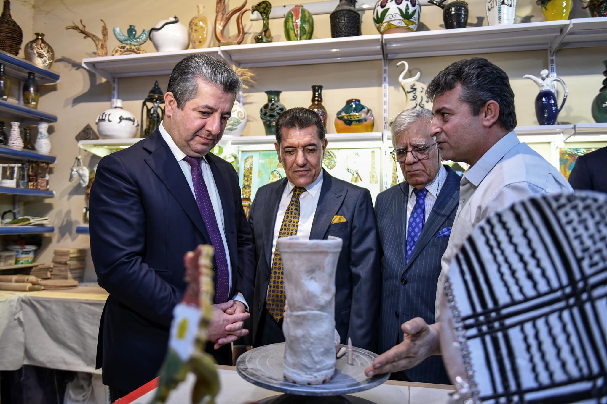 Kurdistan Region Prime Minister Masrour Barzani (left) reviewing arts work at festival of Fine Arts college in Erbil, Nov. 14, 2023. (Photo: KRG)