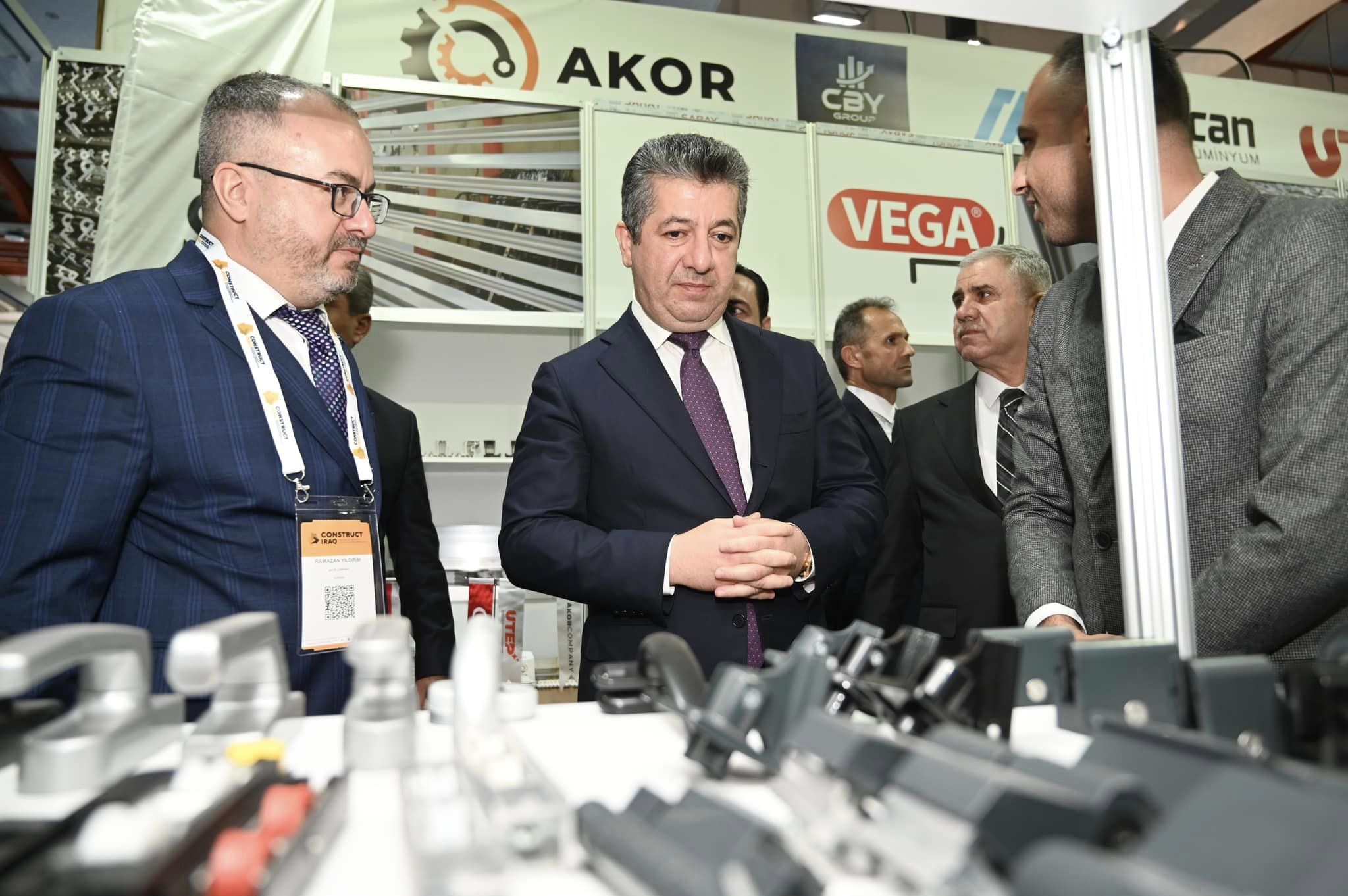 Kurdistan Region Prime Minister Masrour Barzani (center) reviewing product samples at Construct Iraq 2023, Nov. 14, 2023. (Photo: KRG)