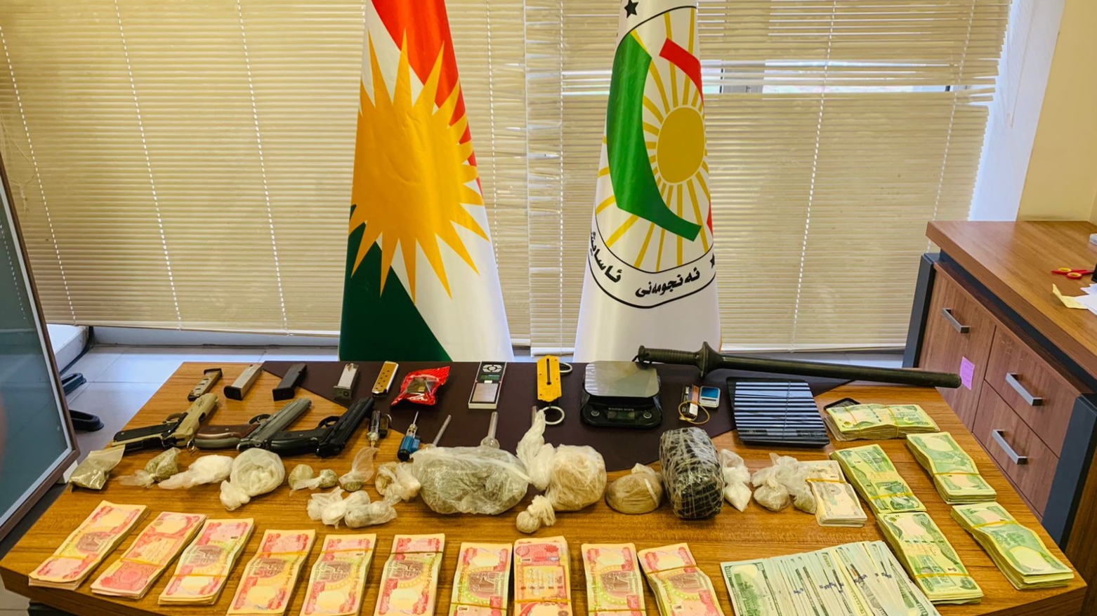 Confiscated narcotics, US and Iraqi currency are on display. (Photo: Kurdistan Region anti-narcotics authority)