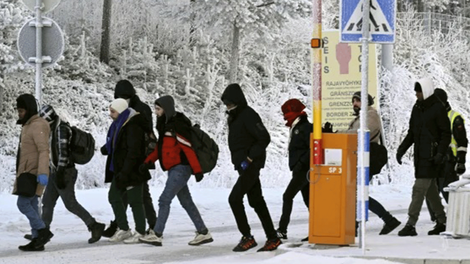 Migrants are seen at the international border crossing at Salla, northern Finland. (Photo: AFP)