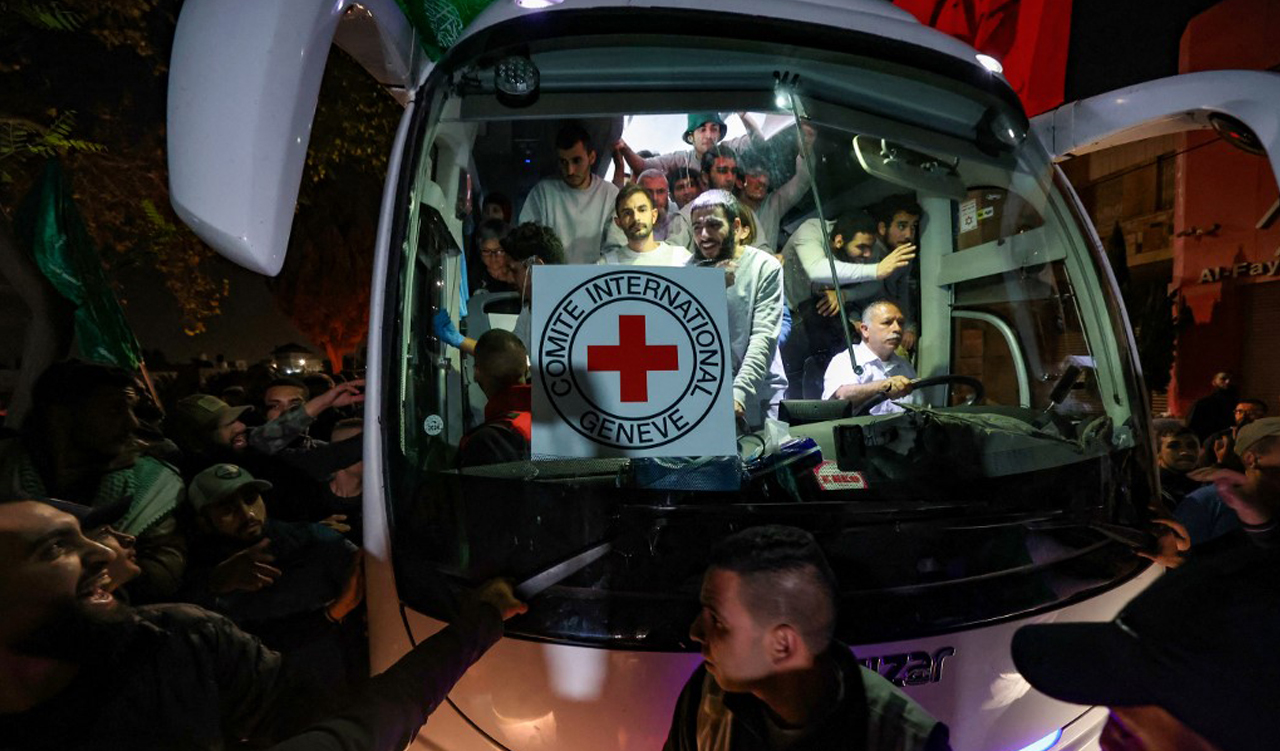 A bus transporting Red Cross staff and Palestinians prisoners released from Israeli jails in exchange for hostages released by Hamas from the Gaza Strip, Nov. 26, 2023. (Photo: Jaafar Ashtiyah/AFP)