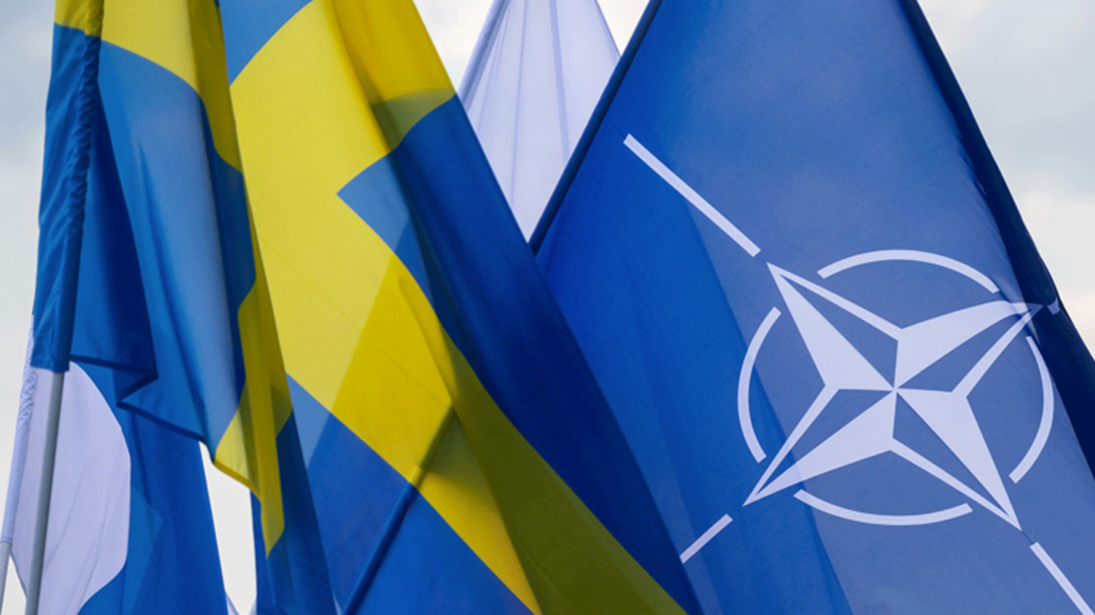 Swedish, and NATO flags are set up prior to the signing ceremony of the law ratifying the NATO Protocol on Finland and Sweden’s membership in Gdynia, Poland, in July 22. (Photo: AFP)