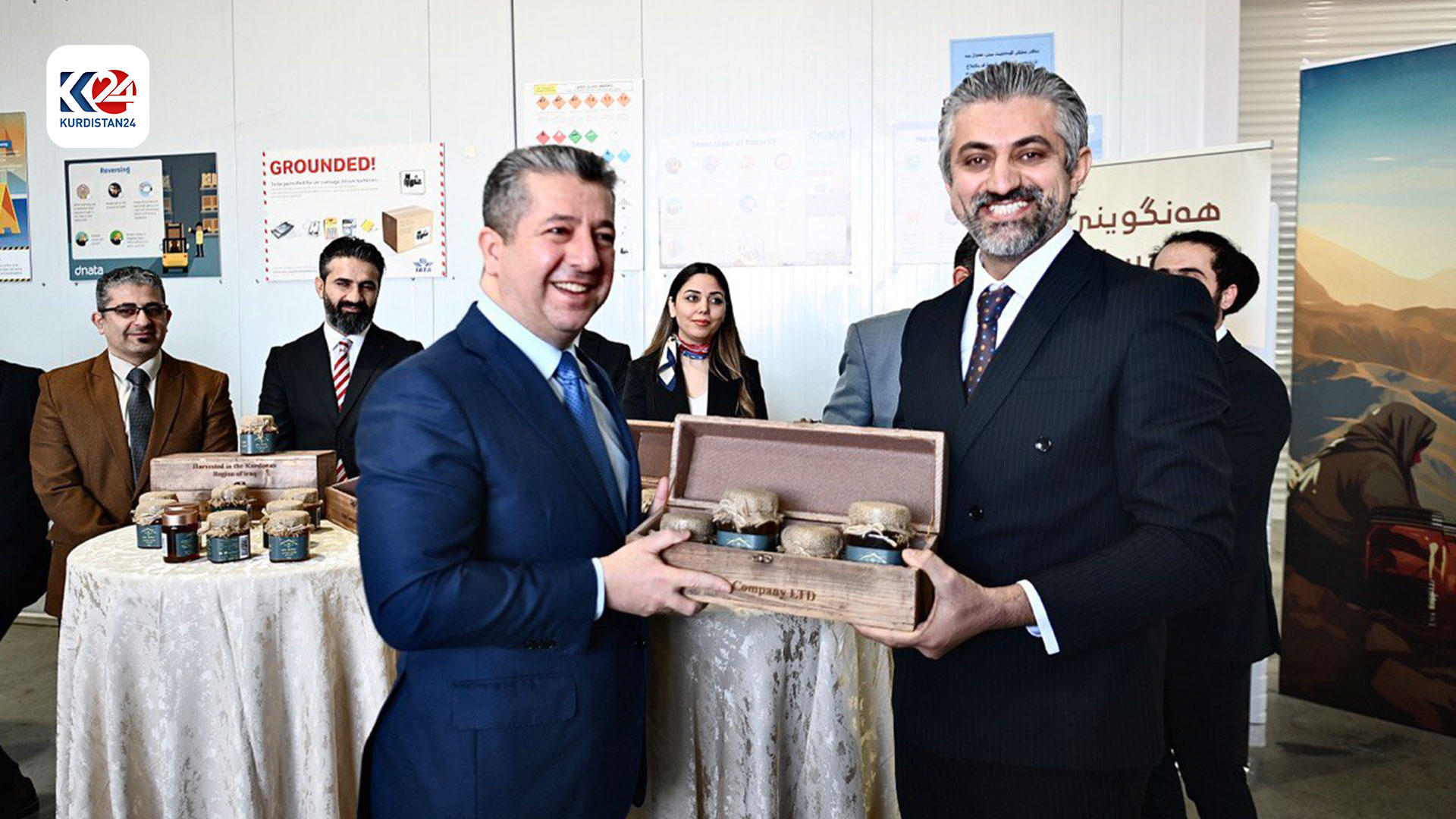 Prime Minister Masrour Barzani showcases honey produced by a local association. (Photo: KRG)