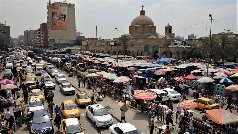 Cars pass Baghdad's Shorja Market. (Photo: AFP)