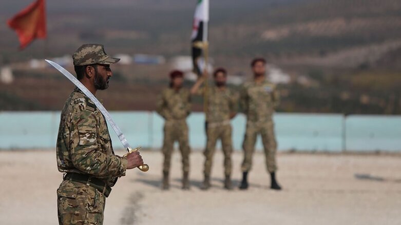 Turkish-backed Syrian fighters of the Sultan Murad brigade are pictured during a military show in the Afrin region in the rebel-held northern countryside of Syria's northern Aleppo province on Nov. 17, 2020 (Photo: Bakr Alkasem/AFP).