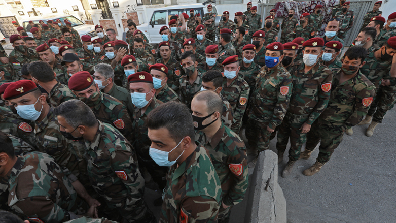 Members of Iraq's Kurdish Peshmerga security forces take part in early voting for the parliamentary elections in Erbil, Oct. 8, 2021. (Photo: Safin Hamed/AFP)