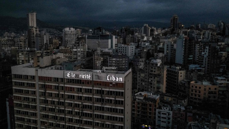 Lebanon's capital Beirut in darkness during a power outage, with the Electricite du Liban (Electricity Of Lebanon) national company headquarters in the foreground, Beirut, Lebanon, April 3, 2021. (AFP Photo)