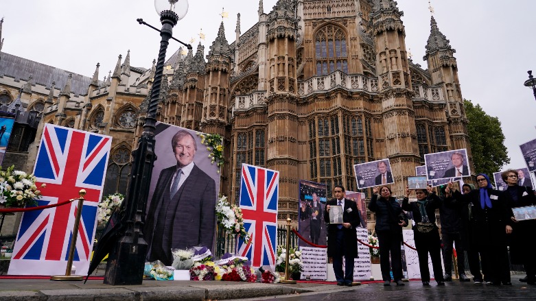 Members of the Anglo-Iranian communities and supporters of the National Council of Resistance of Iran hold a memorial service for British MP David Amess outside the Houses of Parliament in London, Monday, Oct. 18, 2021. (Photo: Alberto Pezz