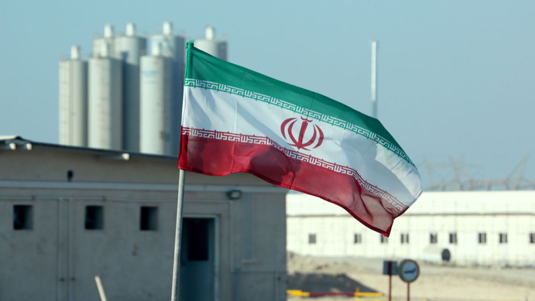 The Iranian flag is flown outside the building housing the reactor of the Bushehr nuclear power plant. (Photo: Atta Kenare/AFP)