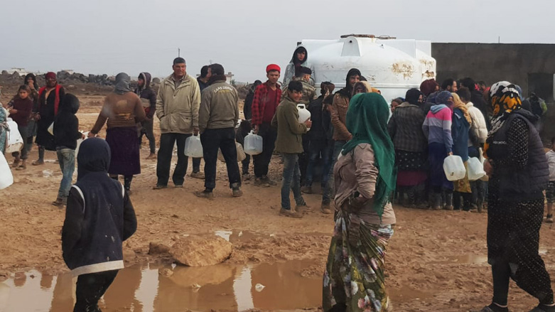 IDPs collect water in the Washokani Camp, Hasakah, Syria, Dec. 14, 2019. (Photo: Kurdistan 24/Wladimir van Wilgenburg)