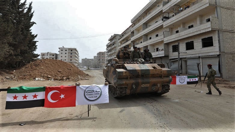 Members of a Turkish-backed militia patrol the Kurdish-majority Syrian city of Afrin. (Photo: AFP)