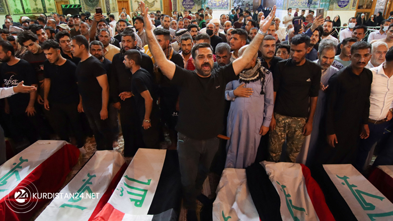 Mourners in southern province of Najaf surround the caskets of victims of yesterday's attack on the village of Al-Rashad in Iraq's eastern Diyala province, Oct. 27, 2021. (Photo: Ali Najafi/AFP)