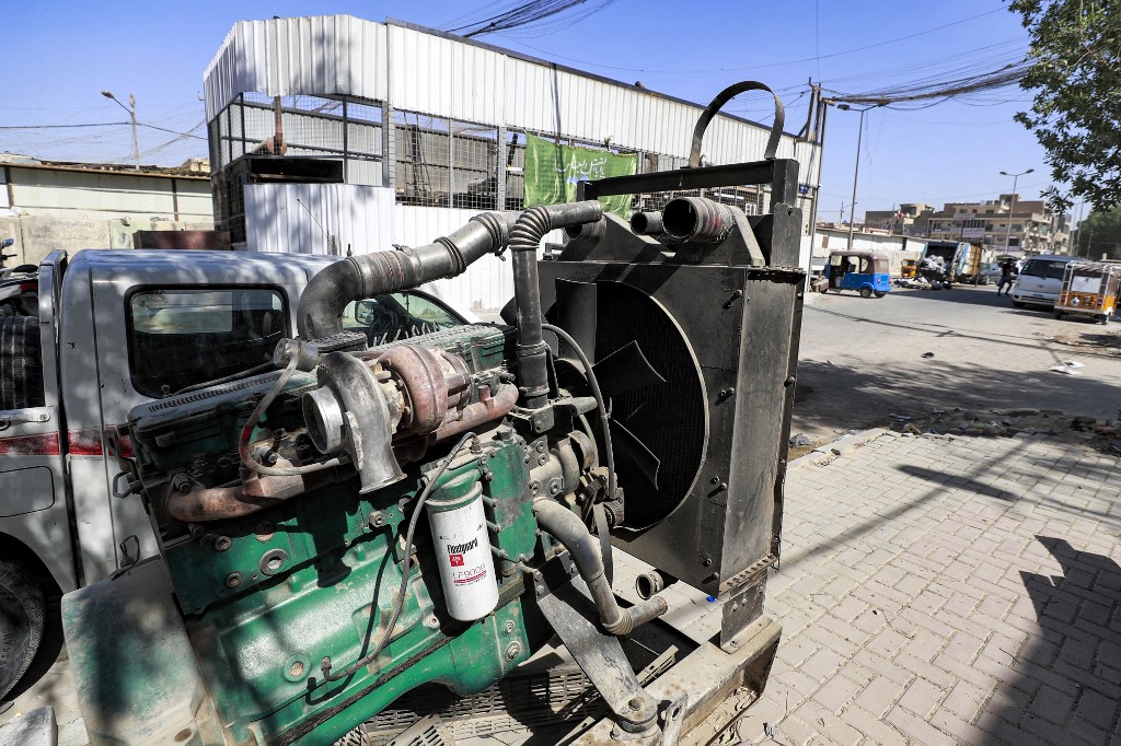 A view of a fuel-based electricity generator not in use placed outside a building housing a battery of generators in the eastern Sadr City suburb of Iraq's capital Baghdad, Sept. 27, 2022. (Photo: Ahmad Al-Rubaye/AFP)