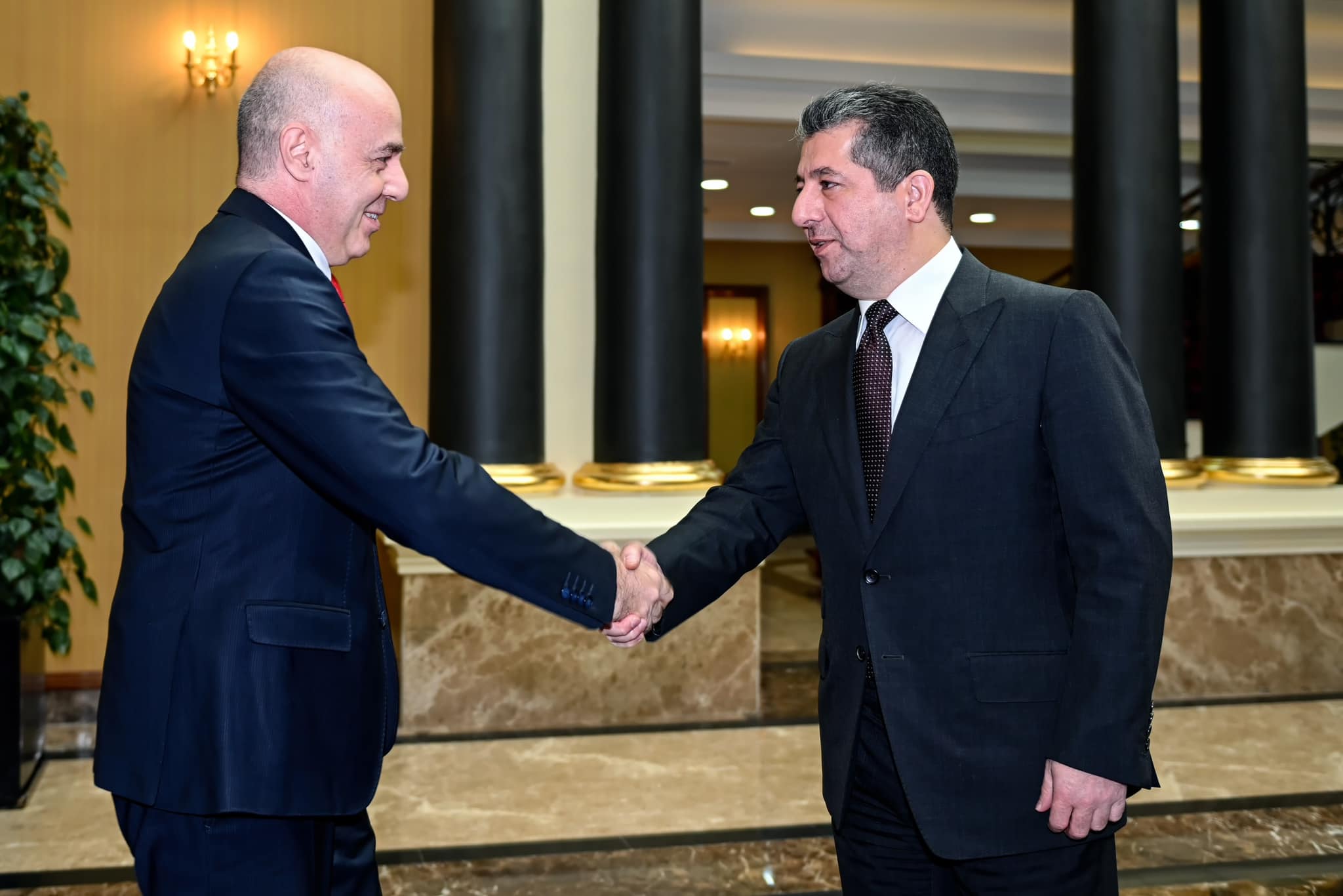 Kurdistan Region Prime Minister Masrour Barzani (right) shaking hands with Turkish Ambassador to Iraq Ali Riza Gunney, Oct. 9, 2022. (Photo: KRG)