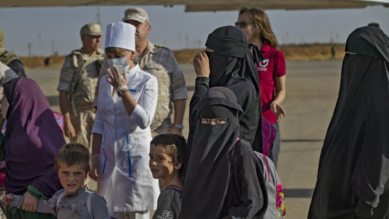 A group of children, among 38 from families of suspected Islamic State (IS) group boarding a plane before being repatriated to Russia, Oct. 20, 2022. (Photo: Delil Souleiman/AFP)