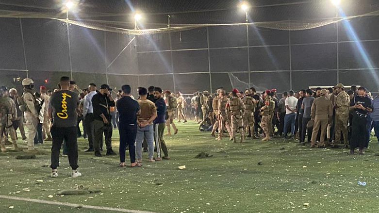 People and security forces are standing inside the soccer stadium in east of Baghdad, in the aftermath of a fuel tanker explosion, Oct. 29, 2022. (Photo: Submitted to Kurdistan 24)