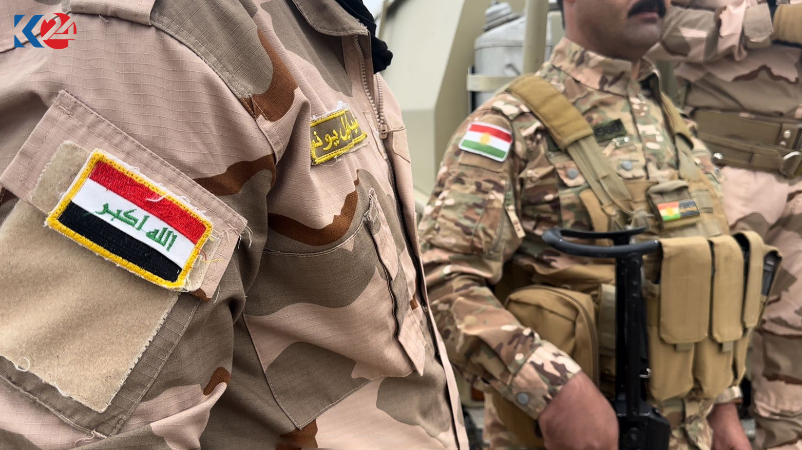 An Iraqi soldier (left) is pictured with a member of Kurdish Peshmerga forces in Qaratapa-Hamrin Sector, Oct. 4, 2023. (Photo: Harem Jaff/Kurdistan 24)