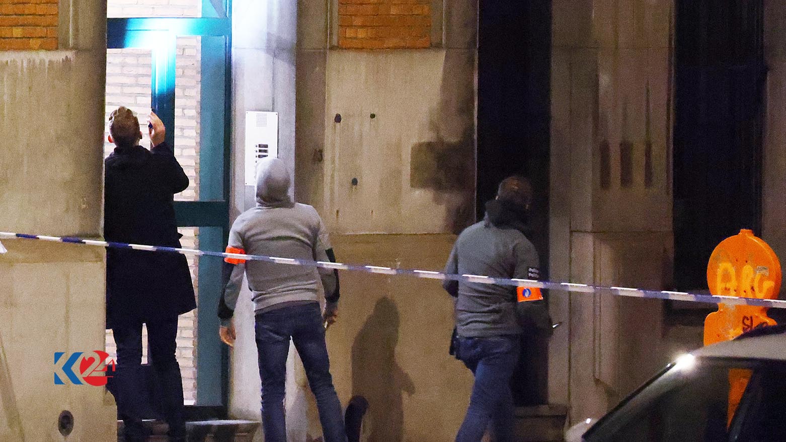 Belgian police officers stand at the entrance of a building after two people were killed during a shooting in Brussels, Oct. 16, 2023. (Photo: Kenzo Tribouillard/ AFP)