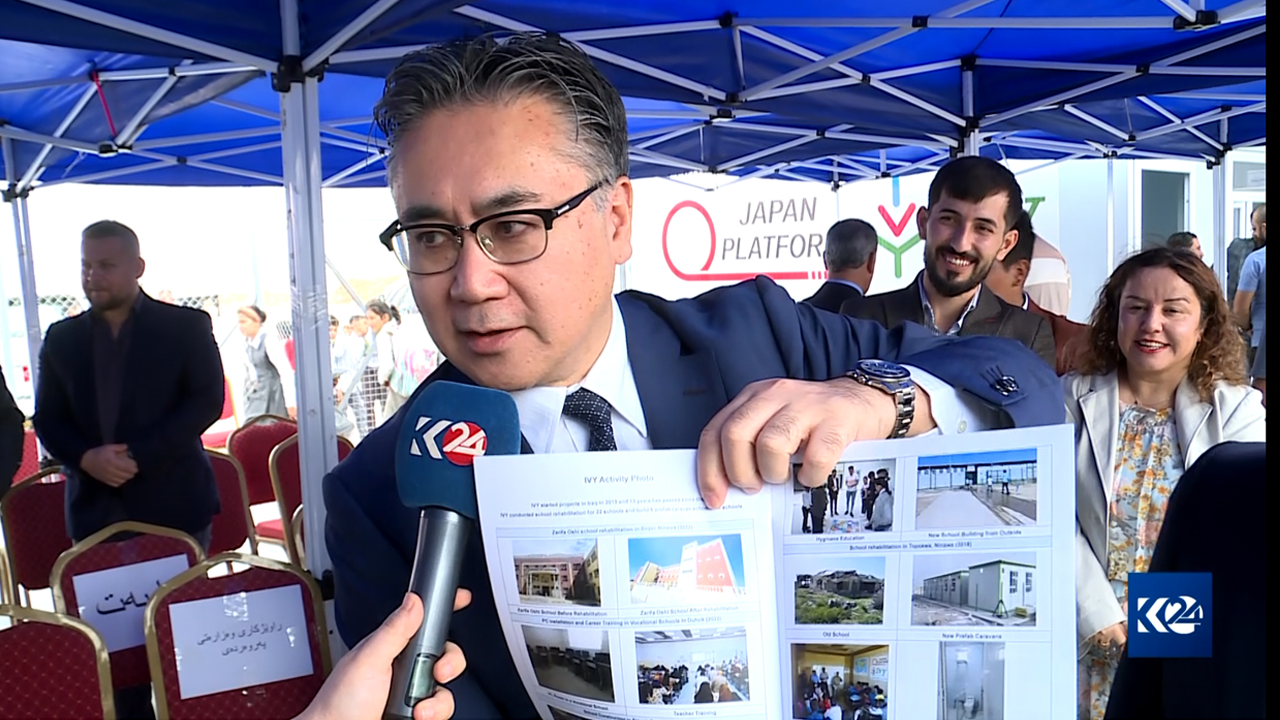Japanese Ambassador to Iraq Futoshi Matsumoto showing a portrait of the school that is now being occupied by the PKK in Sinjar, Oct. 19, 2023. (Photo: Kurdistan 24)