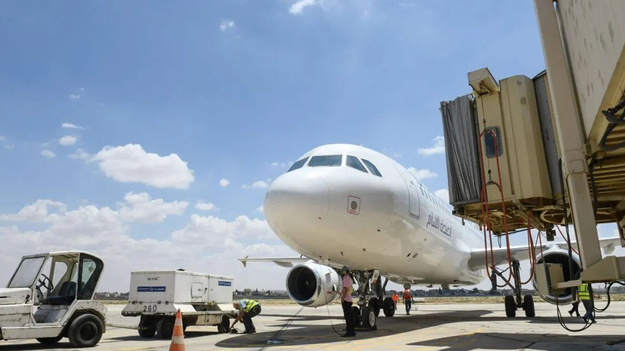 A parked aircraft is on display at Aleppo airport. (Photo: AFP)