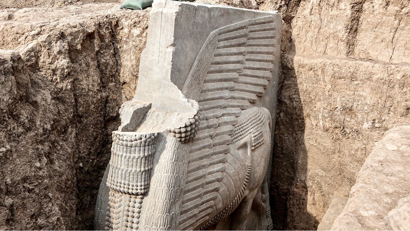 This picture taken on Oct. 24, shows a view of a newly-unearthed Assyrian Lamassu alabaster sculpture discovered with its entire wings intact by the French archaeological mission. (Photo: Zaid Al-Obeidi/ AFP)