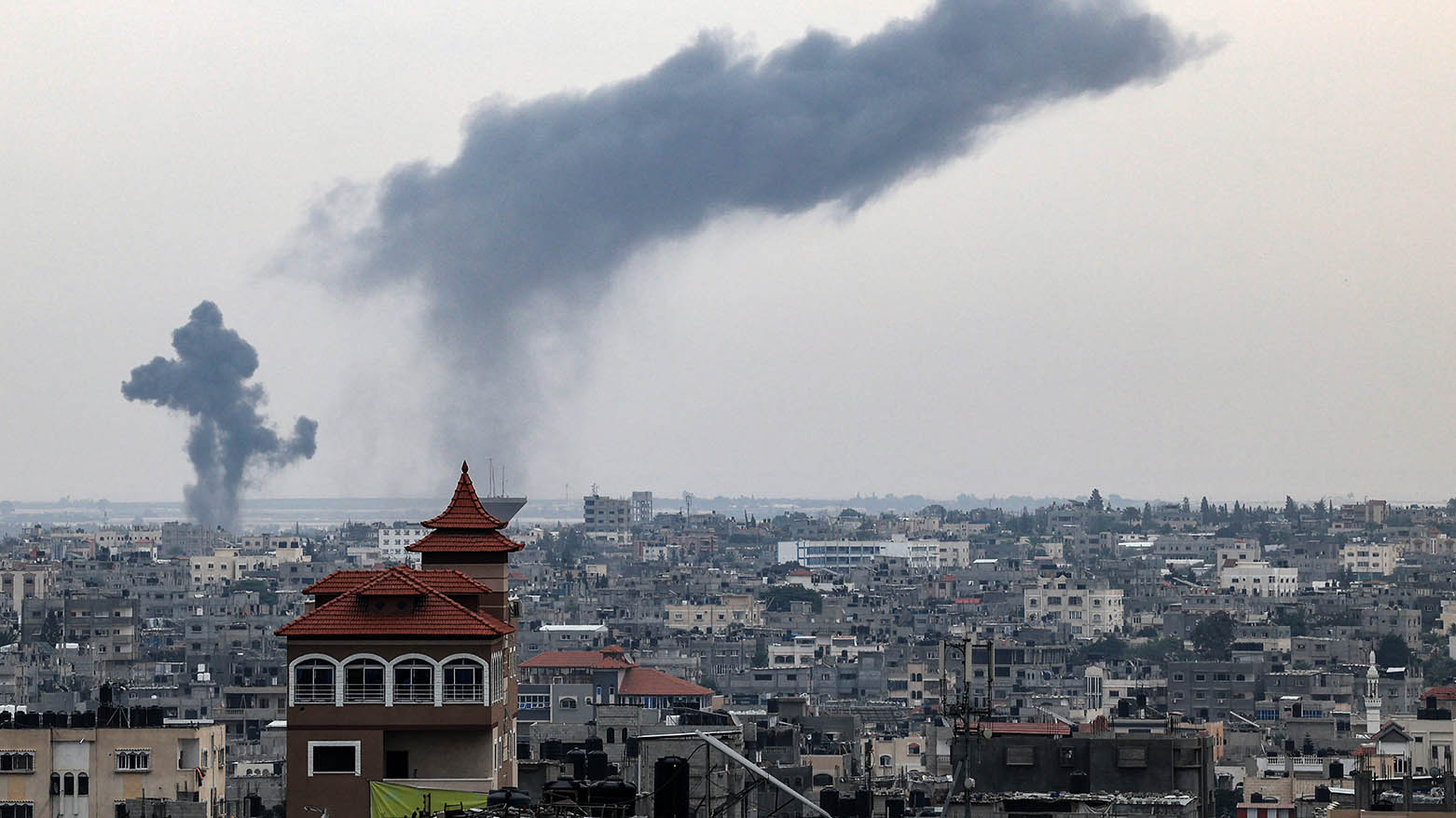 Smoke rises above buildings during an Israeli strike in Rafah in the southern Gaza Strip on October 27, 2023. (Photo: Said Khatib/ AFP)