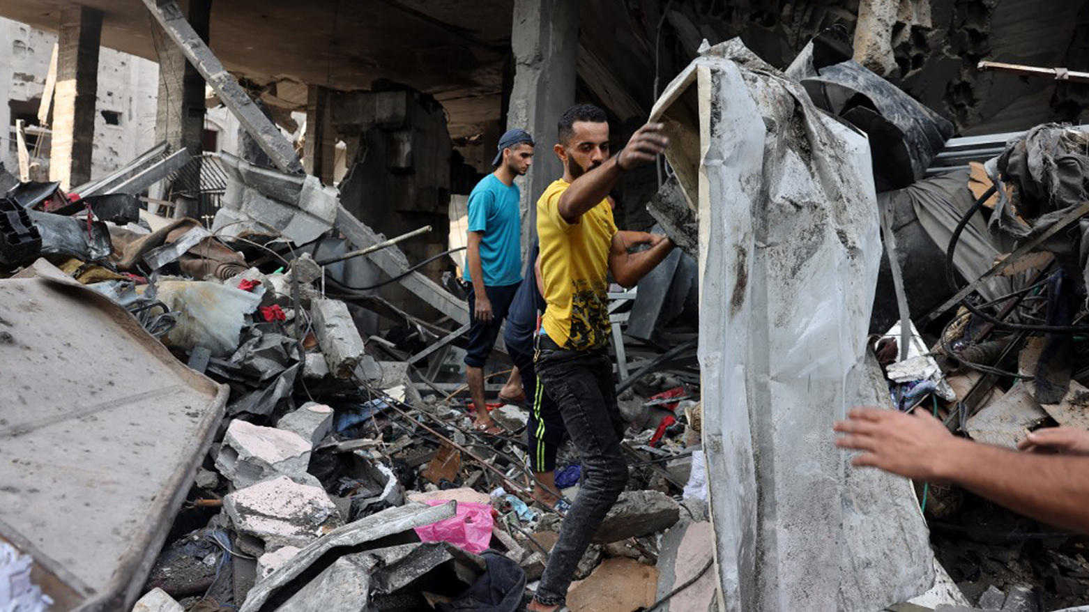 People sift through the rubble of a destroyed building following Israeli strikes on Al-Shatee camp in Gaza City, Oct. 28, 2023. (Photo: Mohammed Abed/AFP)