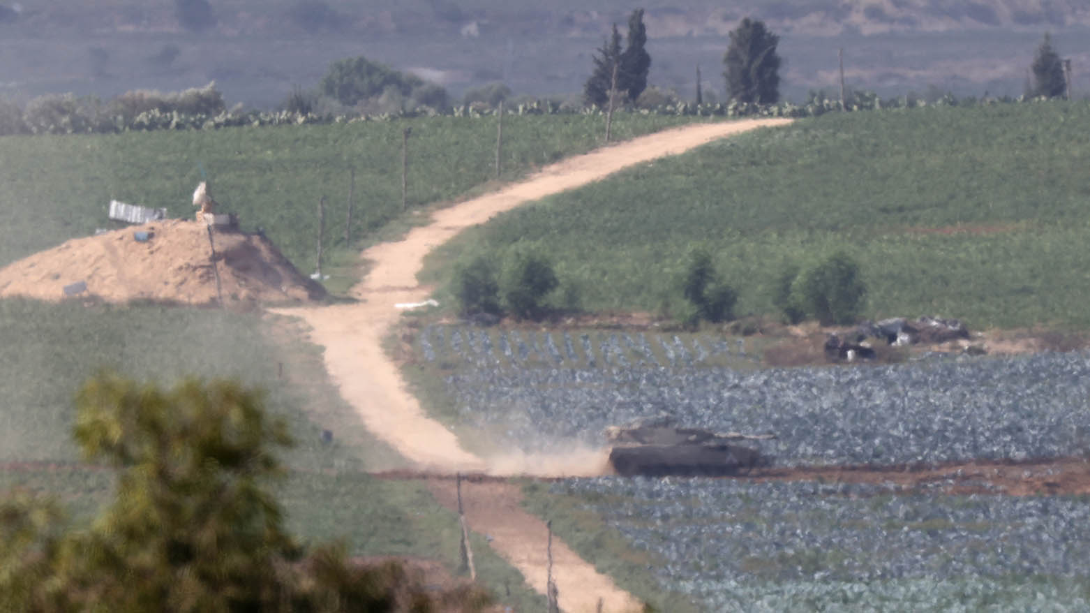 A picture taken from Israel's southern city of Sderot shows an Israeli tank advancing in the north of the Gaza Strip, on October 30, 2023. (Photo: AFP)