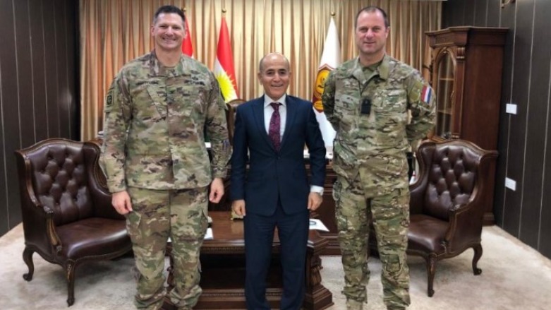 Kurdistan Region Minister of Peshmerga Affairs Shorsh Ismail (center) poses with officials from the US-led Coalition to Defeat ISIS, including Colonel Todd Burroughs (left). (Photo: CJTFOIR)