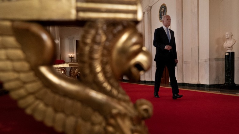 US President Joe Biden walks through the cross hall to speak in the State Dining Room of the White House about the final pullout of US troops from Afghanistan August 31, 2021. (Photo: BRENDAN SMIALOWSKI / AFP)