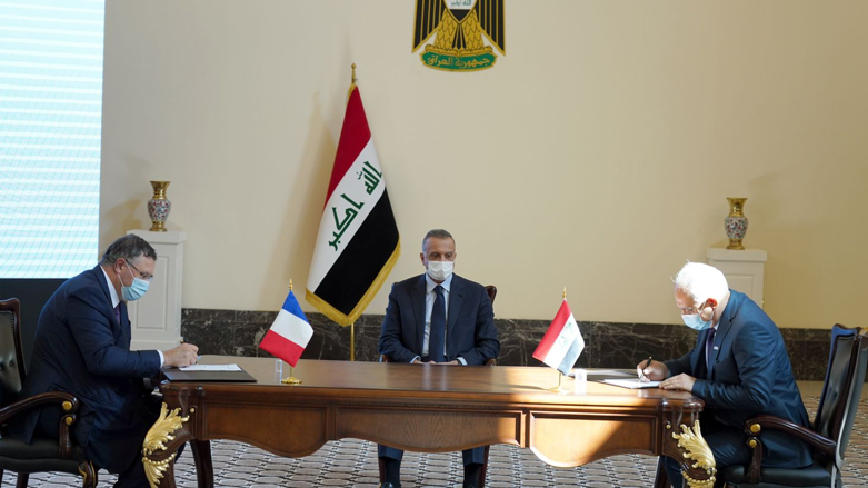 Iraqi Prime Minister Mustafa al-Kadhimi oversees the signing of an agreement with the French energy giant Total. (Photo: The Iraqi government)