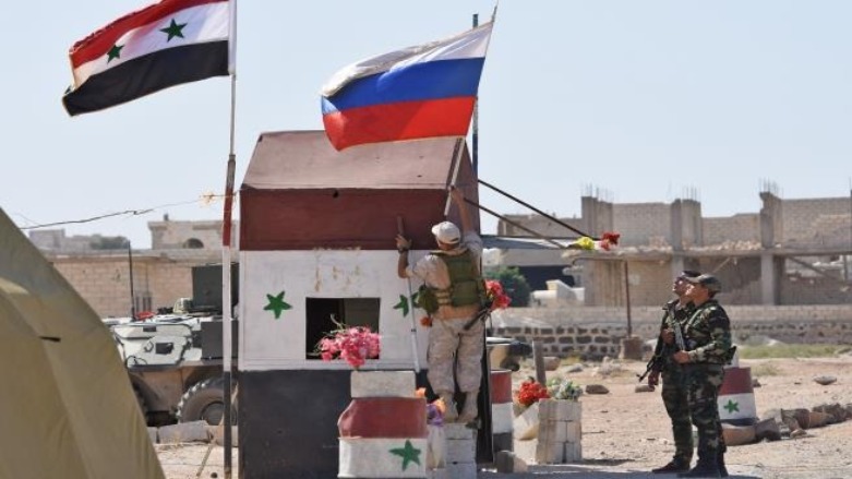 رفع العلمين الروسي والسوري في درعا