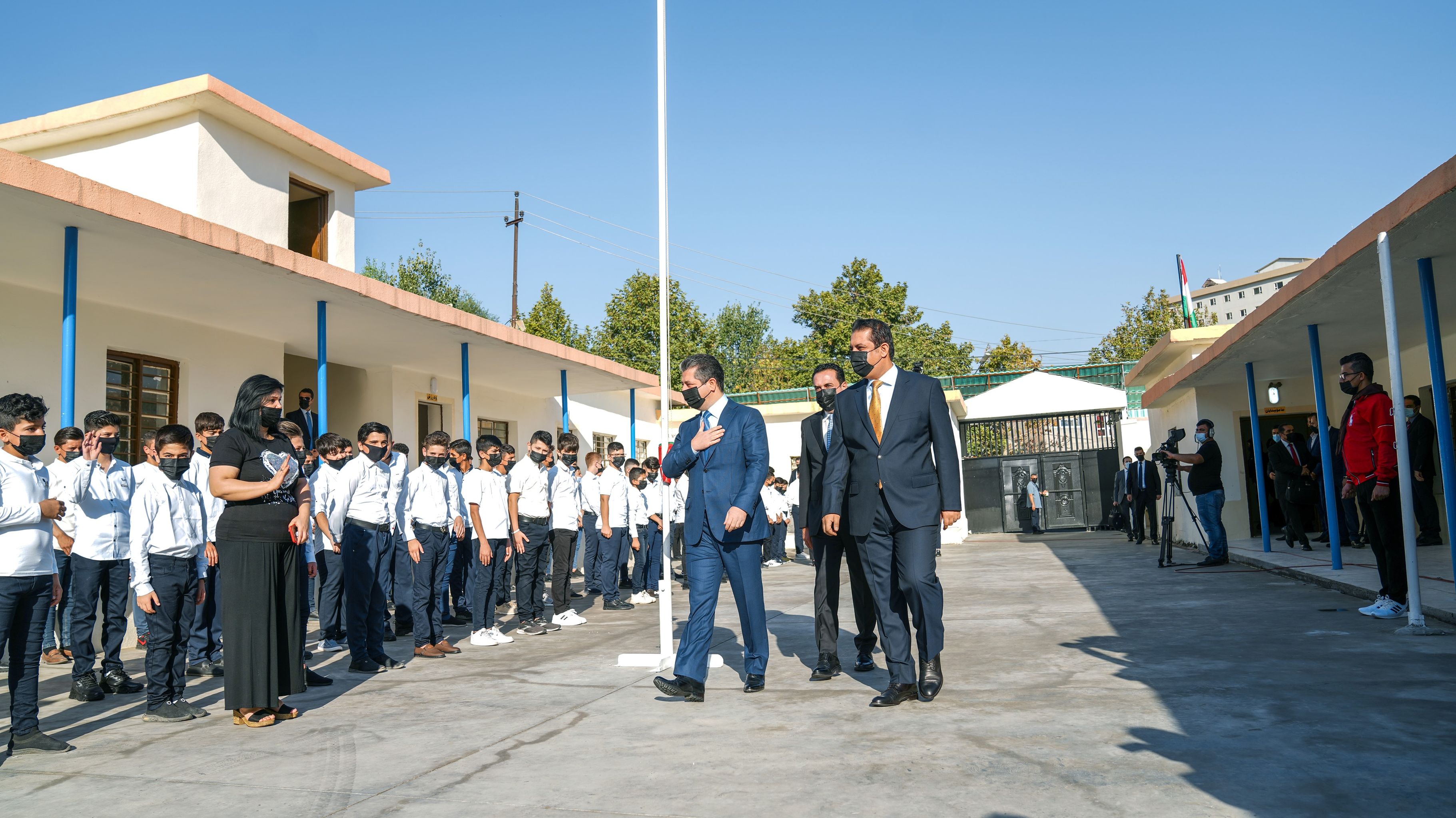 PM Masrour Barzani walk alongside KRG Minister of Education Alan Hama Saeed and Erbil Governer Omed Khoshnaw to speak at an event marking beginning of school year, Sept. 14, 2021. (Photo: KRG) 