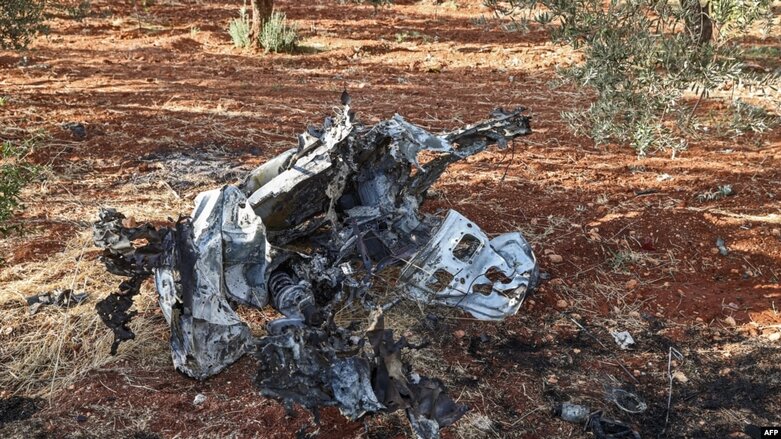 This picture taken on Sept. 20, 2021, shows a vehicle destroyed by what is believed to be a drone strike, on the northeastern outskirts of Syria's rebel-held northwestern city of Idlib (Photo: AFP)
