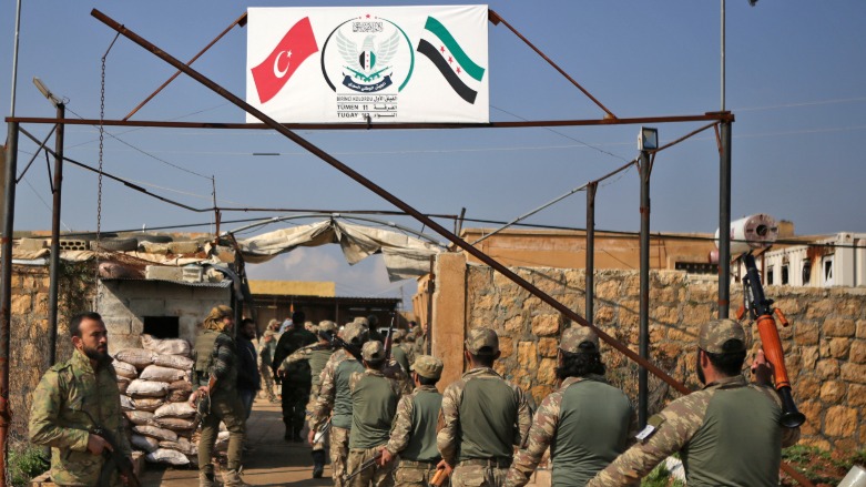 Turkish-backed fighters take part in a training at a military barracks, north of the Syrian town of Manbij on 6 March (Photo: AFP)