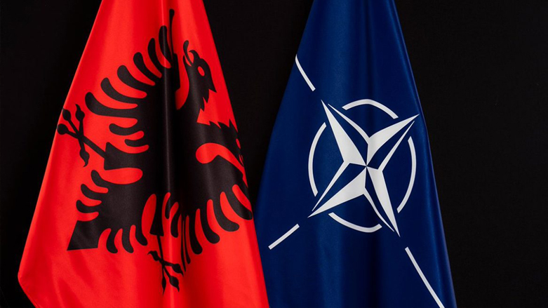 The Albanian flag next to the North Atlantic Treaty Organization (NATO) flag. (Photo: Anadolu Agency)