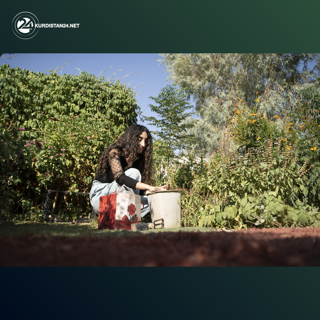 Khalida Shamo, 28, gardening at a displaced camp in Duhok province. (Photo: Anadolu Agency)