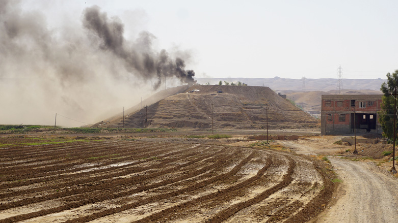 Smoke billows on the horizon in the village of Altrun Kupri, in the Sherawa region, south of Arbil in Iraq's Kurdistan, where a base of the Kurdistan Freedom Party is located, Sept. 28, 2022. (Photo: Shwan Nawzad/AFP)