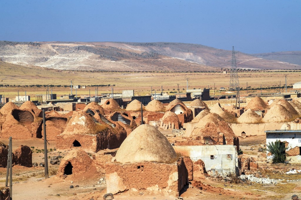 A photo shows traditional mud-brick houses known as 'beehive houses' in the village of Umm Amuda al-Kabira in Aleppo's eastern countryside, north of Damascus, August 11, 2023. (Photo: AFP)