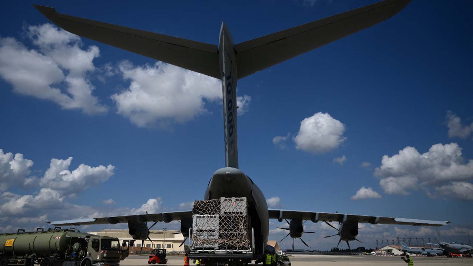 French servicemen and emergency personnel load cargo onto a French Air Force Airbus A400M-180 aircraft, Sept. 13, 2023. (Photo: Christoph Simon/AFP)