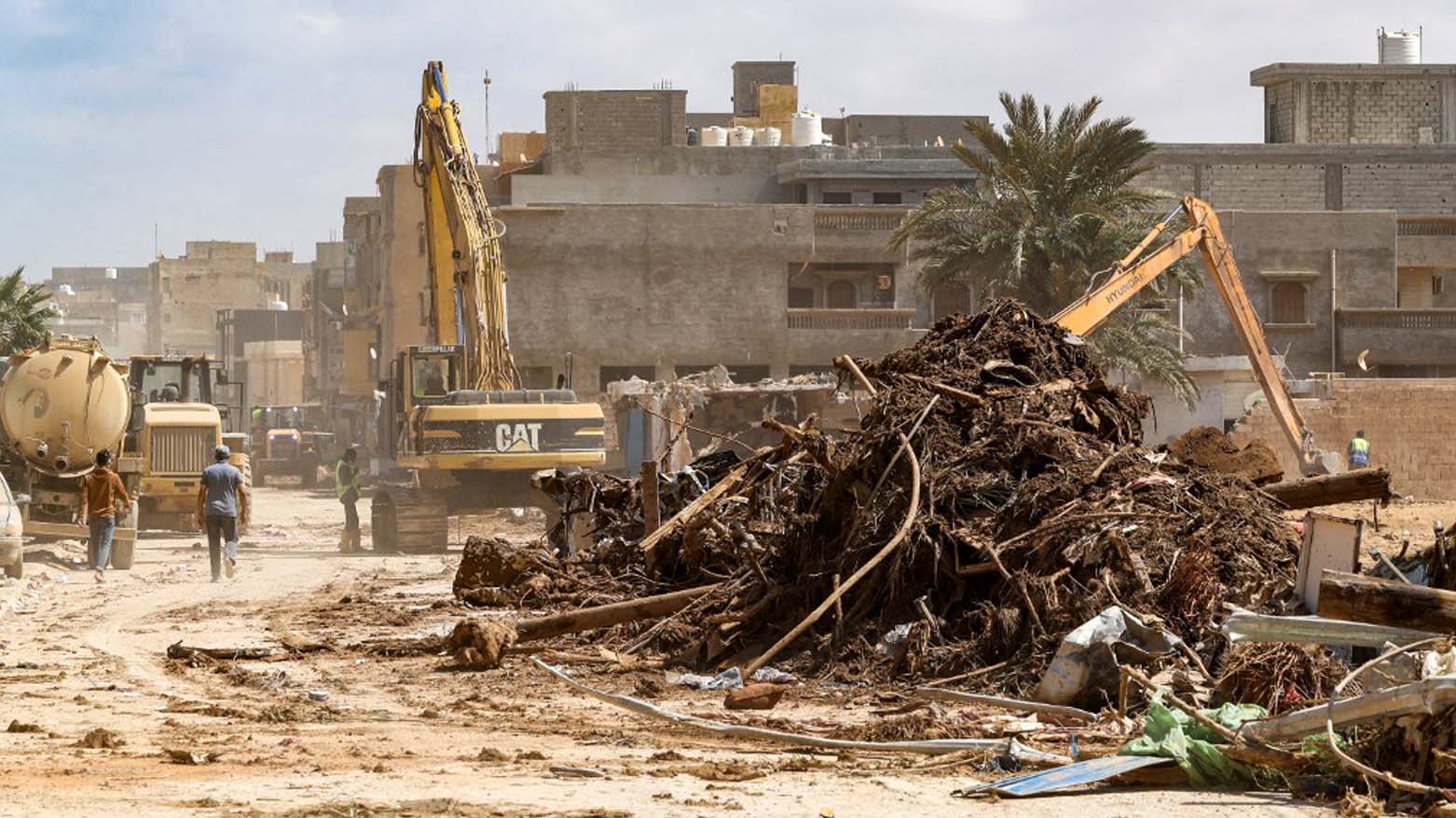 An excavator clears debris in Libya's eastern city of Derna on September 18, 2023, following deadly flash floods, Sept. 18, 2023. (Photo: Mahmud Turkia/AFP)
