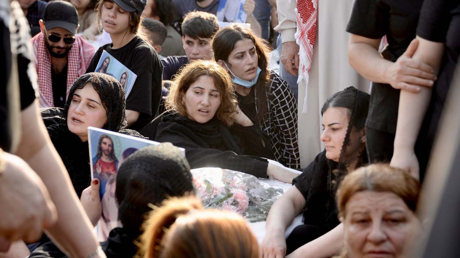 Mourners attend the funeral of victims who were killed when a fire ripped through a crowded wedding hall in the mainly Christian northern city of Qaraqosh, also known as Hamdaniyah, Sept. 27, 2023. (Photo: Zaid Al-Obeidi/AFP)