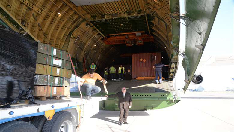 French Consul standing in front of the plane that transferred French weapons to Erbil. 