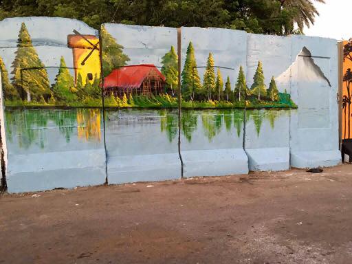 بالصور.. عراقيون يحولون الكتل الخرسانية الى لوحات فنية