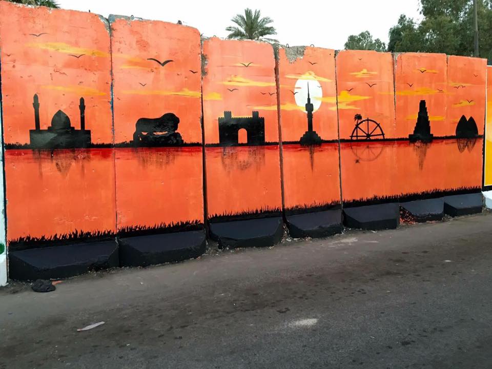 بالصور.. عراقيون يحولون الكتل الخرسانية الى لوحات فنية