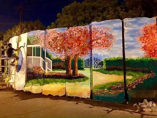 بالصور.. عراقيون يحولون الكتل الخرسانية الى لوحات فنية